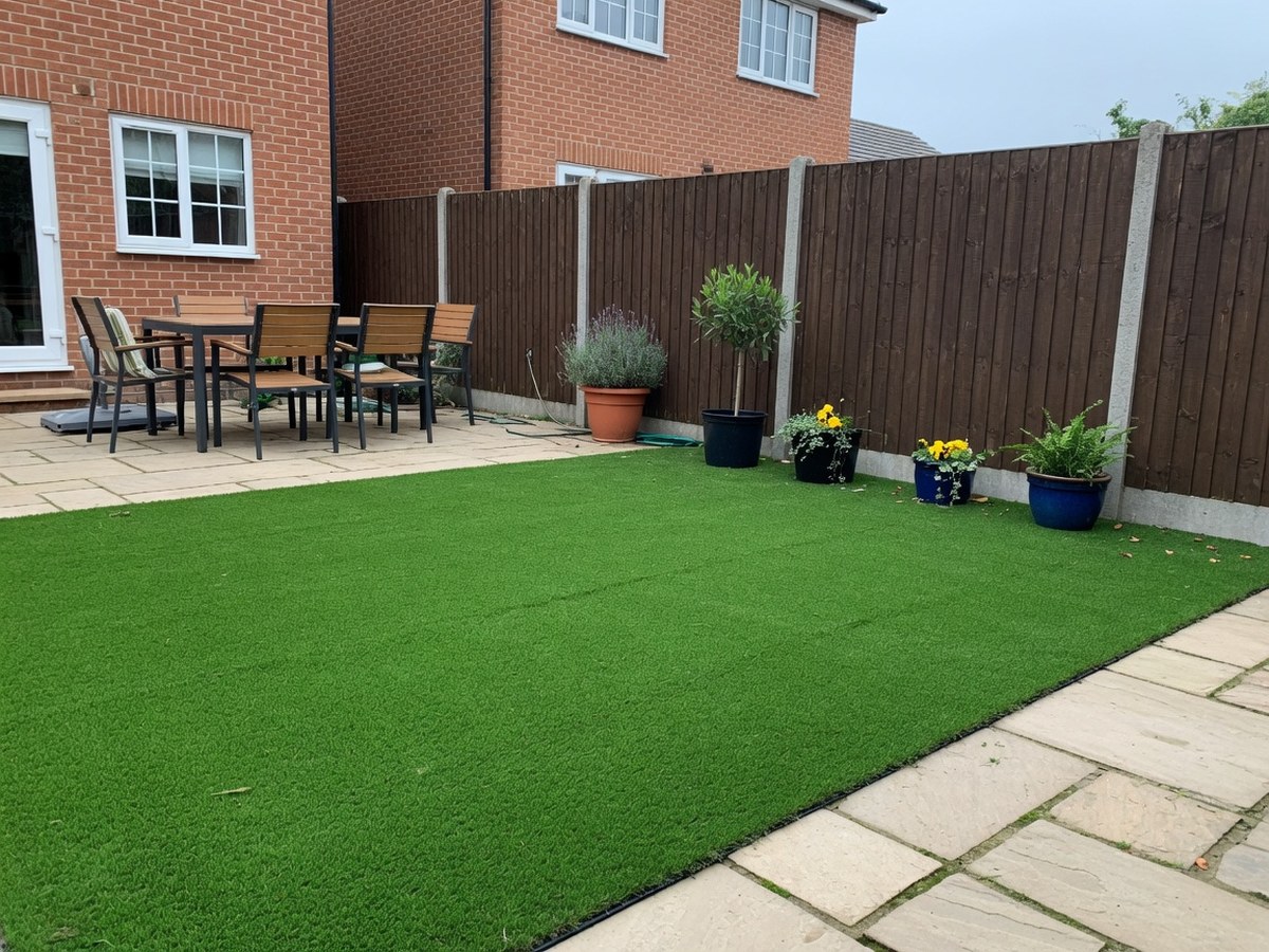 British garden lawn with timber fencing on three sides