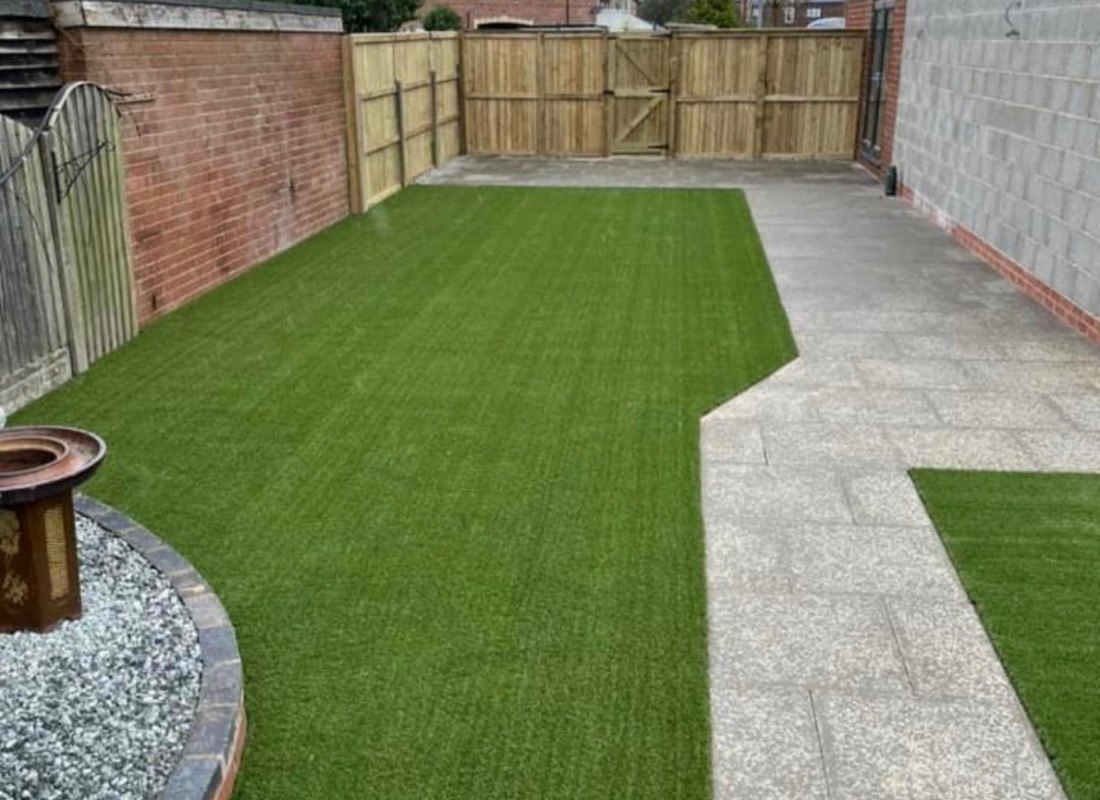 New timber fence, laid lawn and flagged path